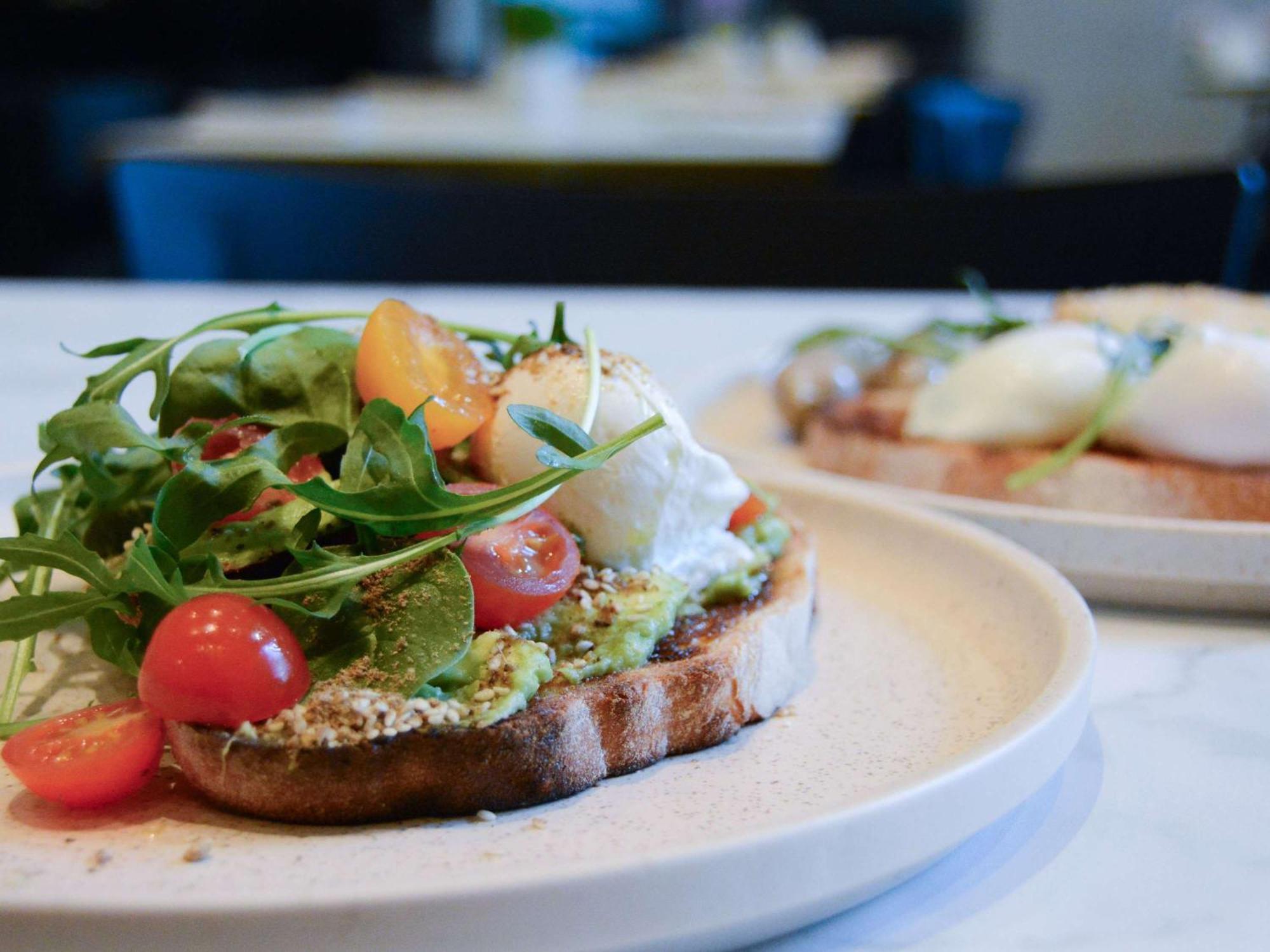 The Como Melbourne Exterior foto Avocado on toast with rocket, cherry tomatoes and goat's cheese